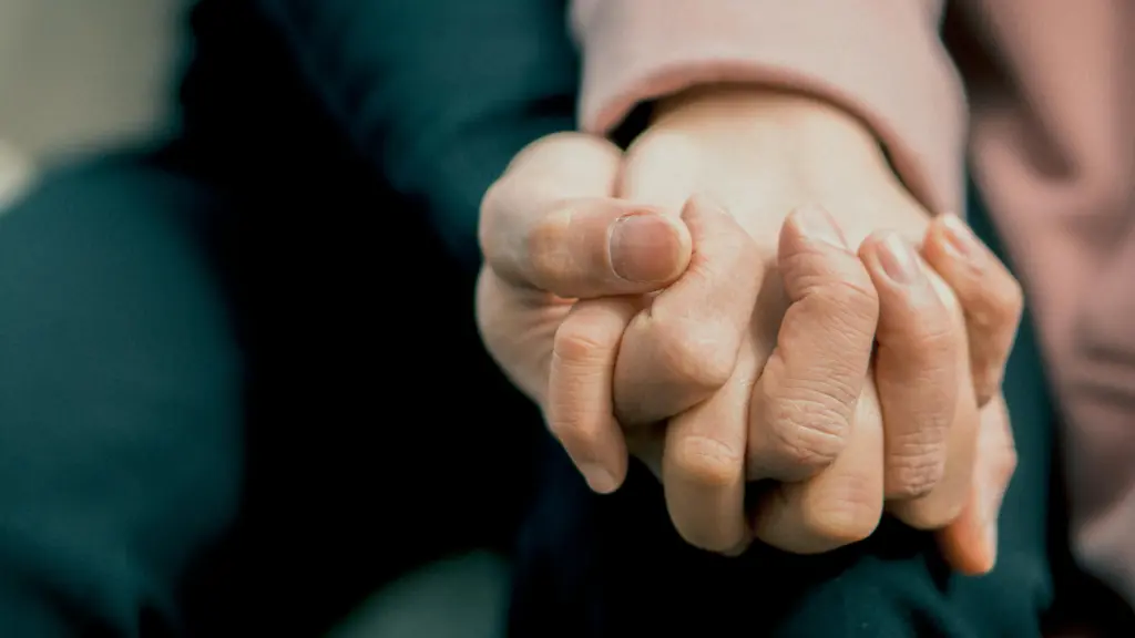 Two Family Members Holding Hands