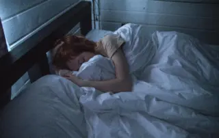 Women In Bed Sleeping Due To Benzodiazepine Side Effects