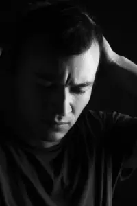 Black And White Image Of Anxious Man Struggling