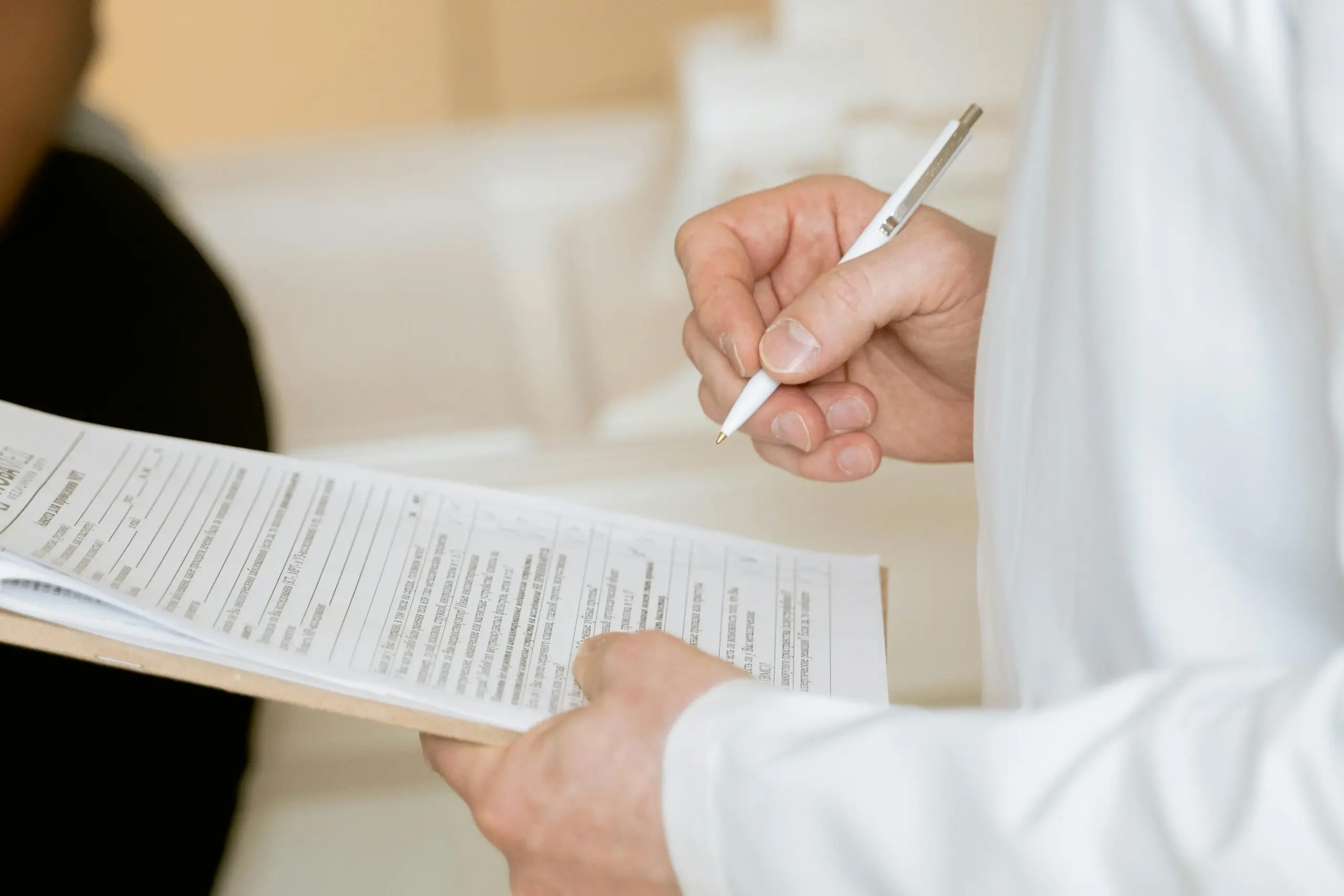 Psychiatrist Taking Notes On Paper